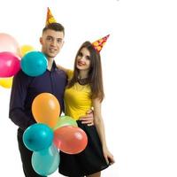 square portrait of young gay couples with balloons is isolated on a white background photo