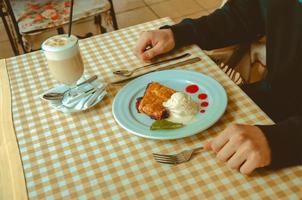 man eating dessert photo