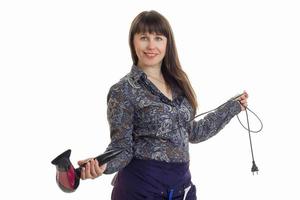 woman Barber holding a hair dryer in Studio isolated on white background photo