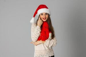 girl in santa hat and red scarf photo