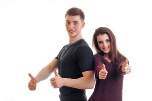 gay young guy and girl stand together laughing stretch hands and show the class photo