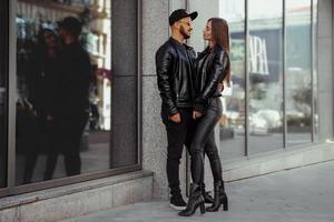 Fashionable couple hugs in the city photo