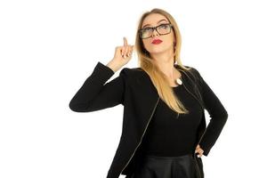 pretty woman in stylish black clothes and glasses posing photo