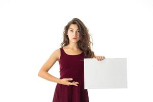 girl in red dress with white placard photo