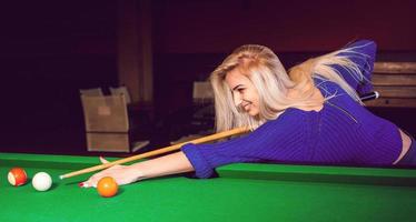 panoramic photo lovely blonde girl playing on the pool table