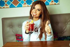 Happy young lady with green eyes smiling on camera photo