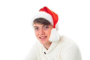 young cheerful man in santa hat photo