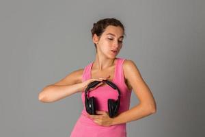 girl with headphones in studio photo