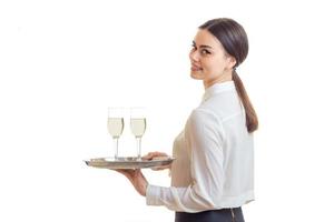 cheerful woman waitress in uniform with trey photo