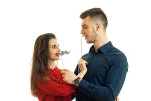 a young attractive couple look at each other and hold near persons transfer paper photo