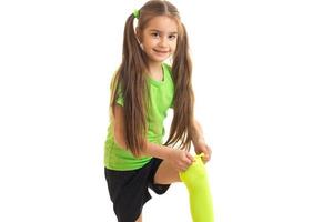 smiling little girl with tails improves sports knee-highs photo