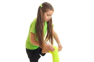 little young girl wearing a green socks photo