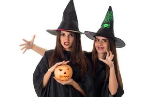young beautiful women with pumpkins in hands photo