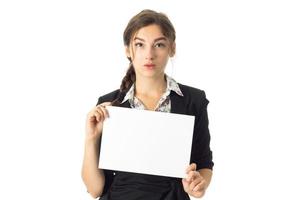 woman in uniform with white placard in hands photo