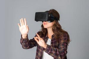 beautiful woman testing virtual reality helmet photo