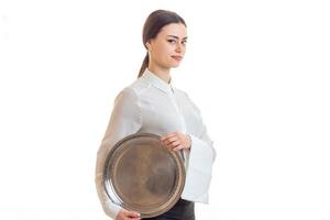 beautiful girl in uniform waiter with a tray in hands photo