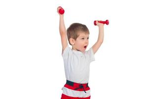 Little boy with a dumbbell photo