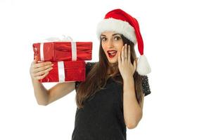 Cute Woman in santa hat with red gift photo