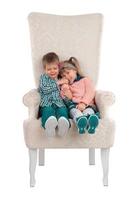 Children sit in a chair photo