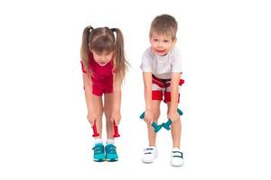 Young children with dumbbells photo