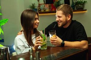 Lovely couple flirting in the bar photo