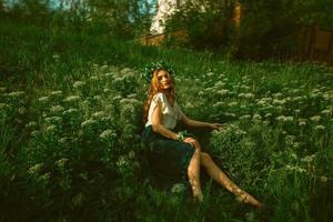 girl posing in the grass photo