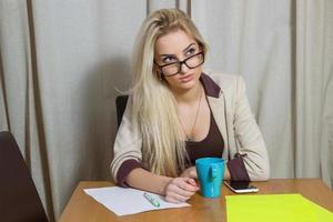 Blonde girl in the office photo
