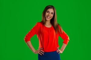 Young girl in red t-shirt looking at the camera and smiling photo