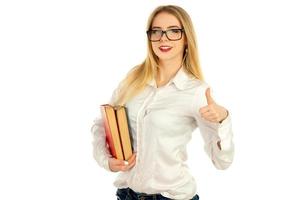 blonde posing with books and smiling photo