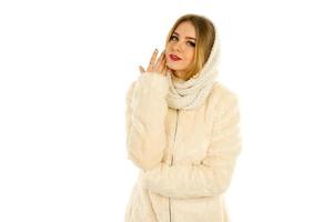 girl in a fur coat and scarf posing photo