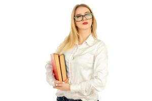 blonde posing with books in studio photo