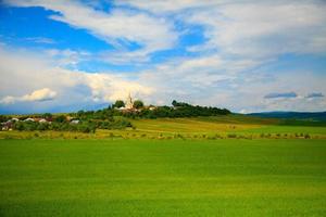 landscape with church on hill photo