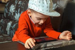 boy in red suit and cap photo