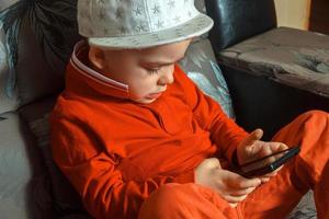 boy in red suit and cap photo