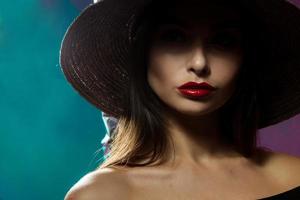 Cute young fashion model in hat photo