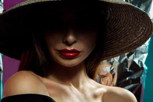 Fashion model in hat with wide brim photo