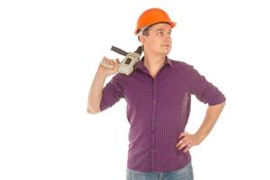 man builder in hardhat with drill in hand photo