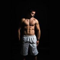 young muscle body man in studio photo