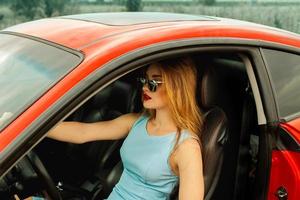 young beautiful woman in car photo