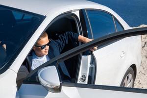 boy posing in sunglasses photo