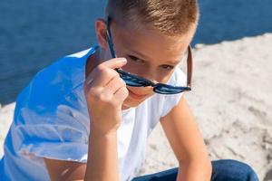 stylish boy at the beach photo