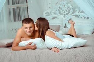 couple in love lying in the bed photo