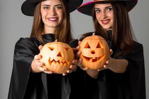 Cheerful girls in halloween style clothes photo