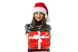 beautiful girl in warm sweater and santa hat photo