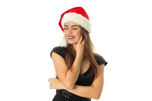 Charming happy girl in santa hat photo