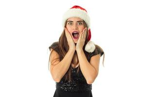 portrait of happy beauty girl in santa hat photo