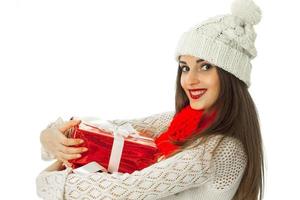 woman in warm sweater and red scarf photo