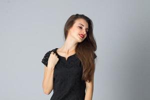 girl in black dress posing in studio photo