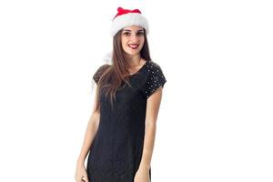 young girl in santa hat smiling photo