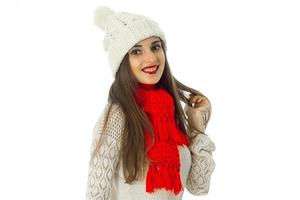 brunette girl in warm sweater and red scarf photo